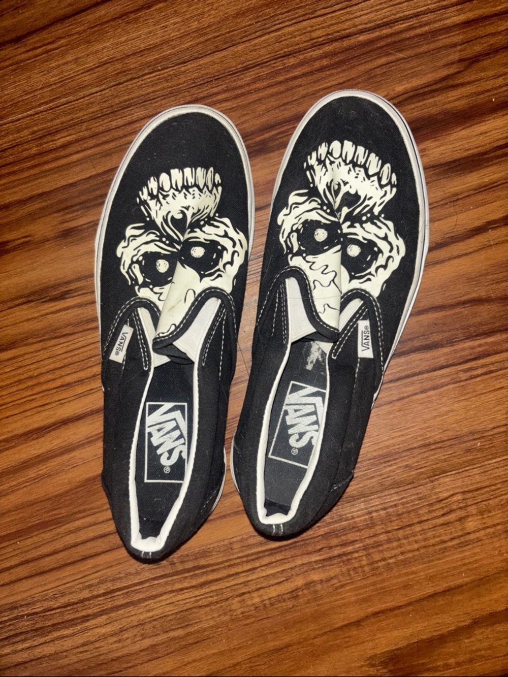 Vans Black & White Slip-On Skull Graphic Sneakers